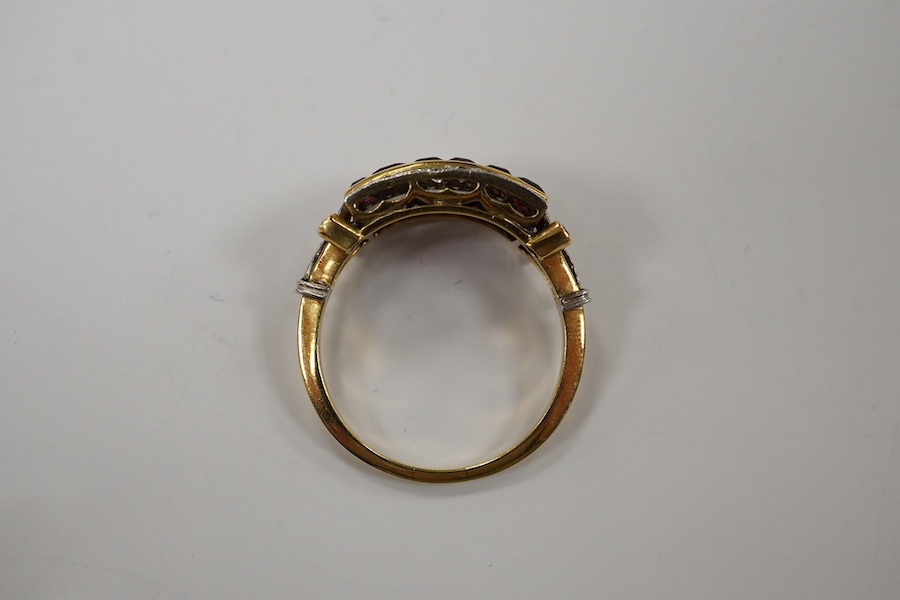 A 1940's? yellow metal, diamond and synthetic ruby set three row ring, (one diamond missing), size O, gross weight 3.7 grams. Condition - poor to fair